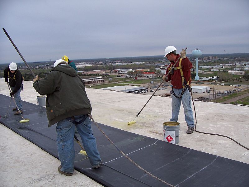Employees working on a flat top roof